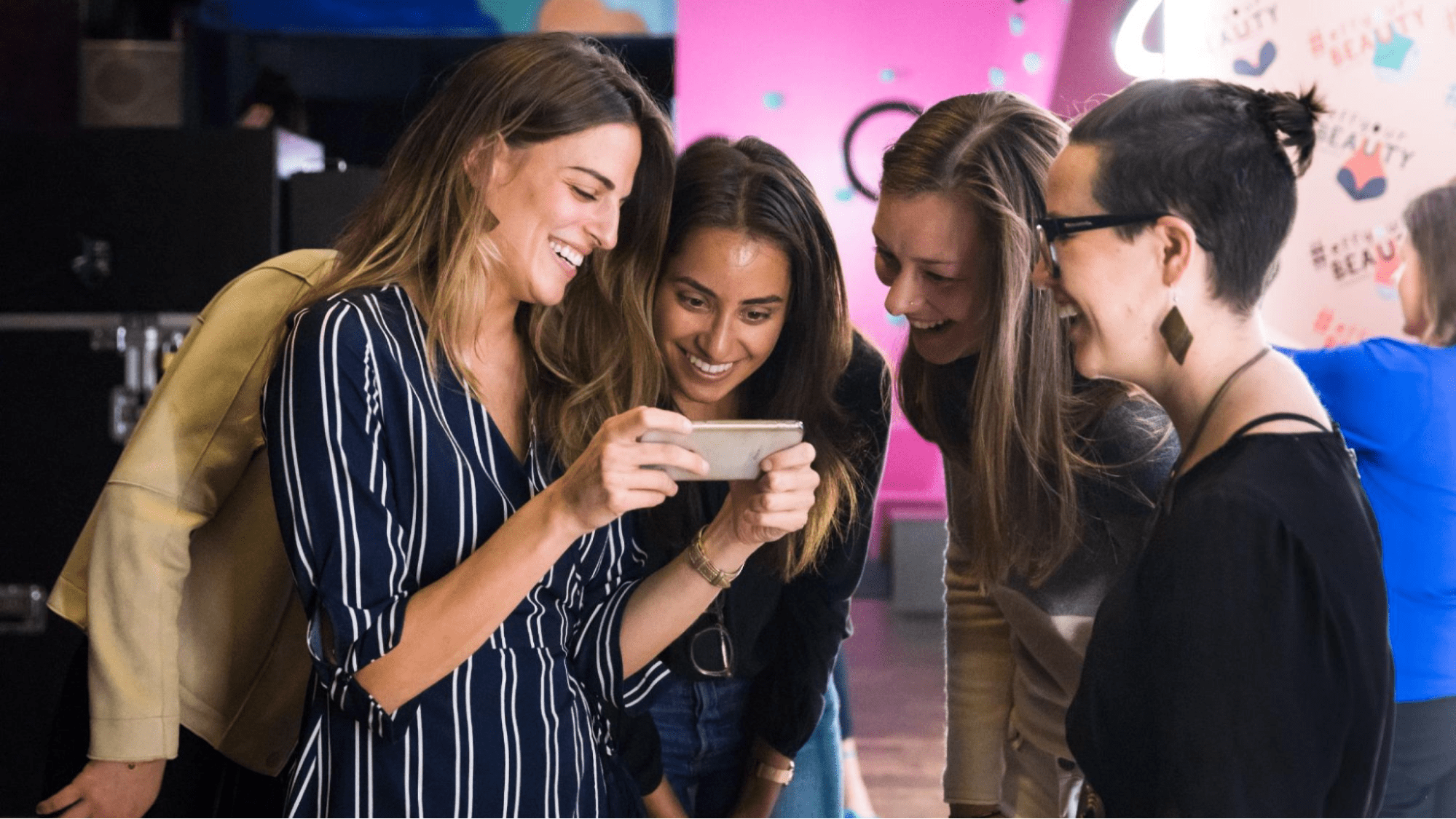 Women looking at phone laughing