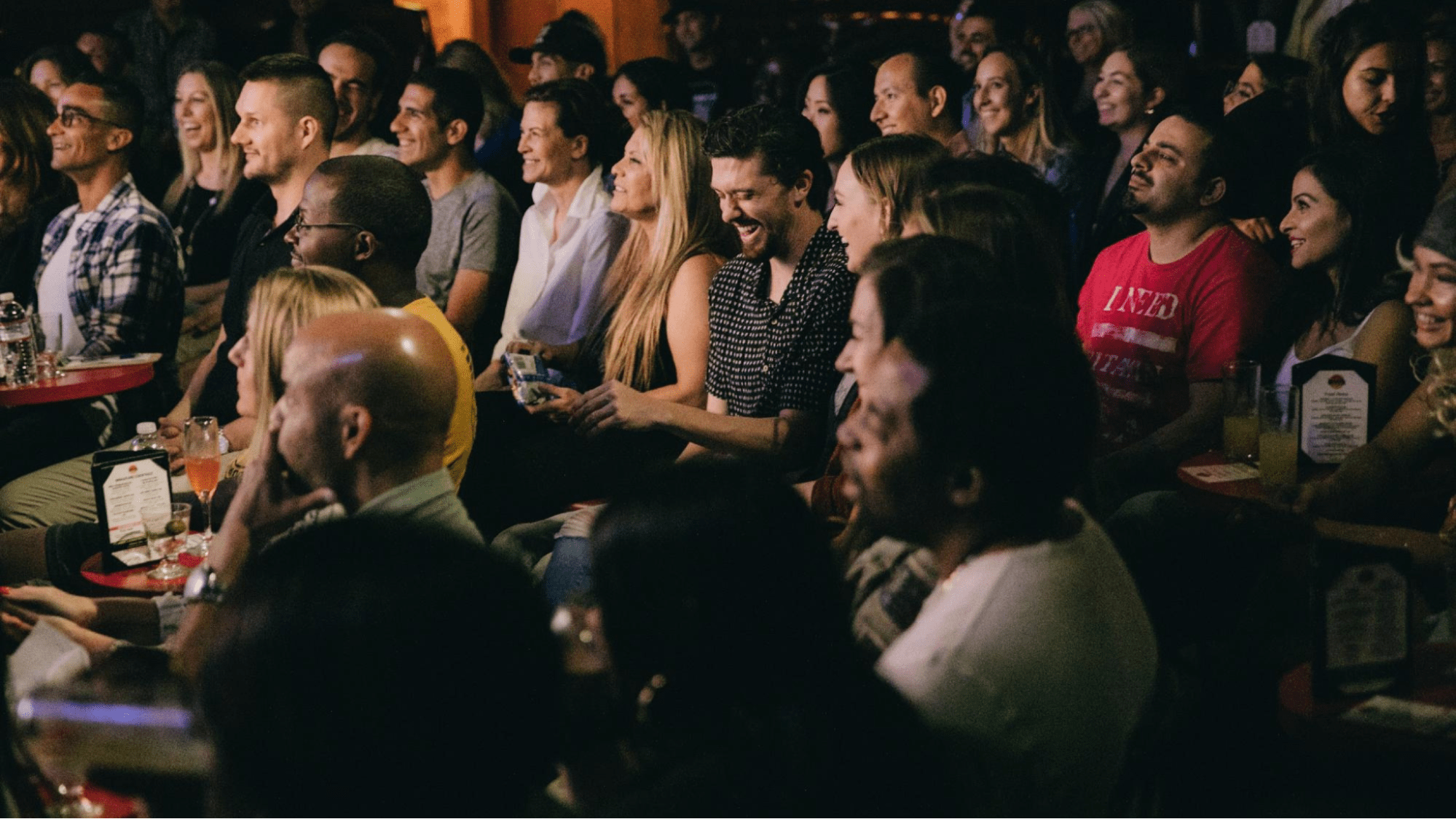 Audience laughing at comedy show