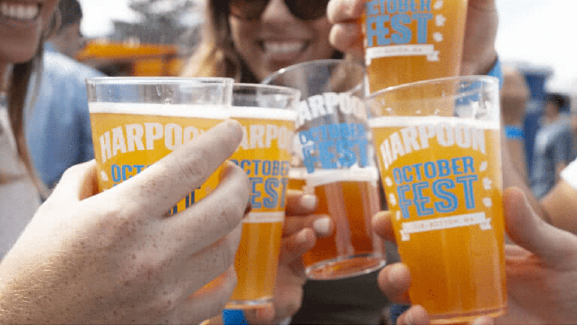 Octoberfest partiers toast with glasses of beer