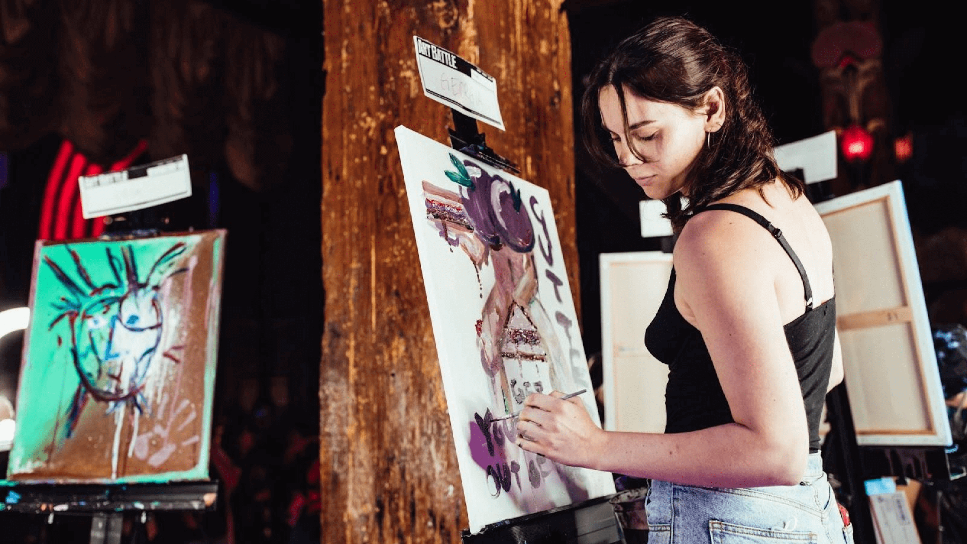 Artist painting at the art battle international experiential marketing event