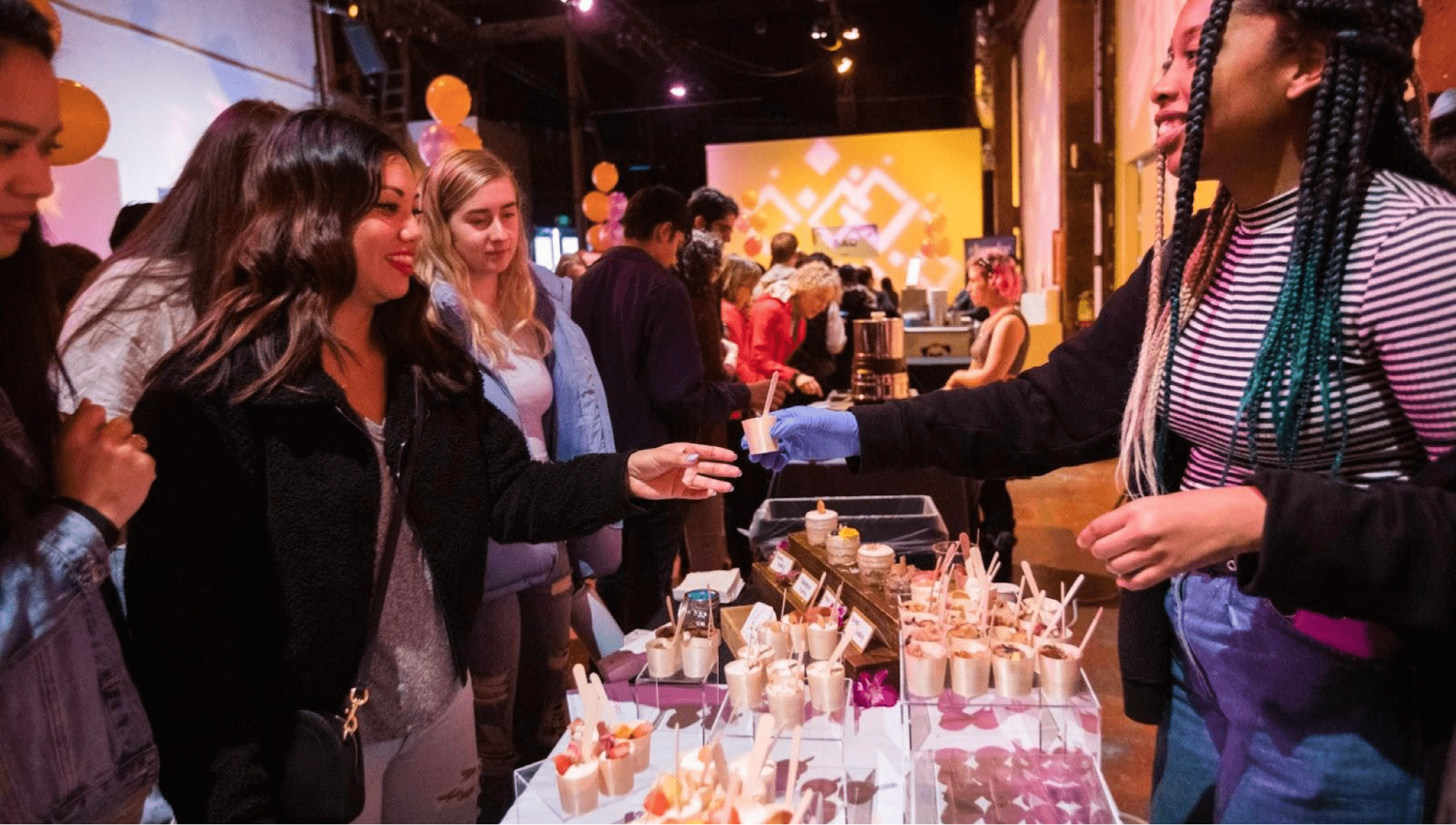 Vendor giving guest food at an experiential marketing event