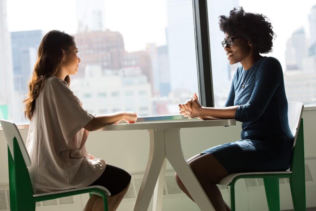 two people sharing ideas during a networking event