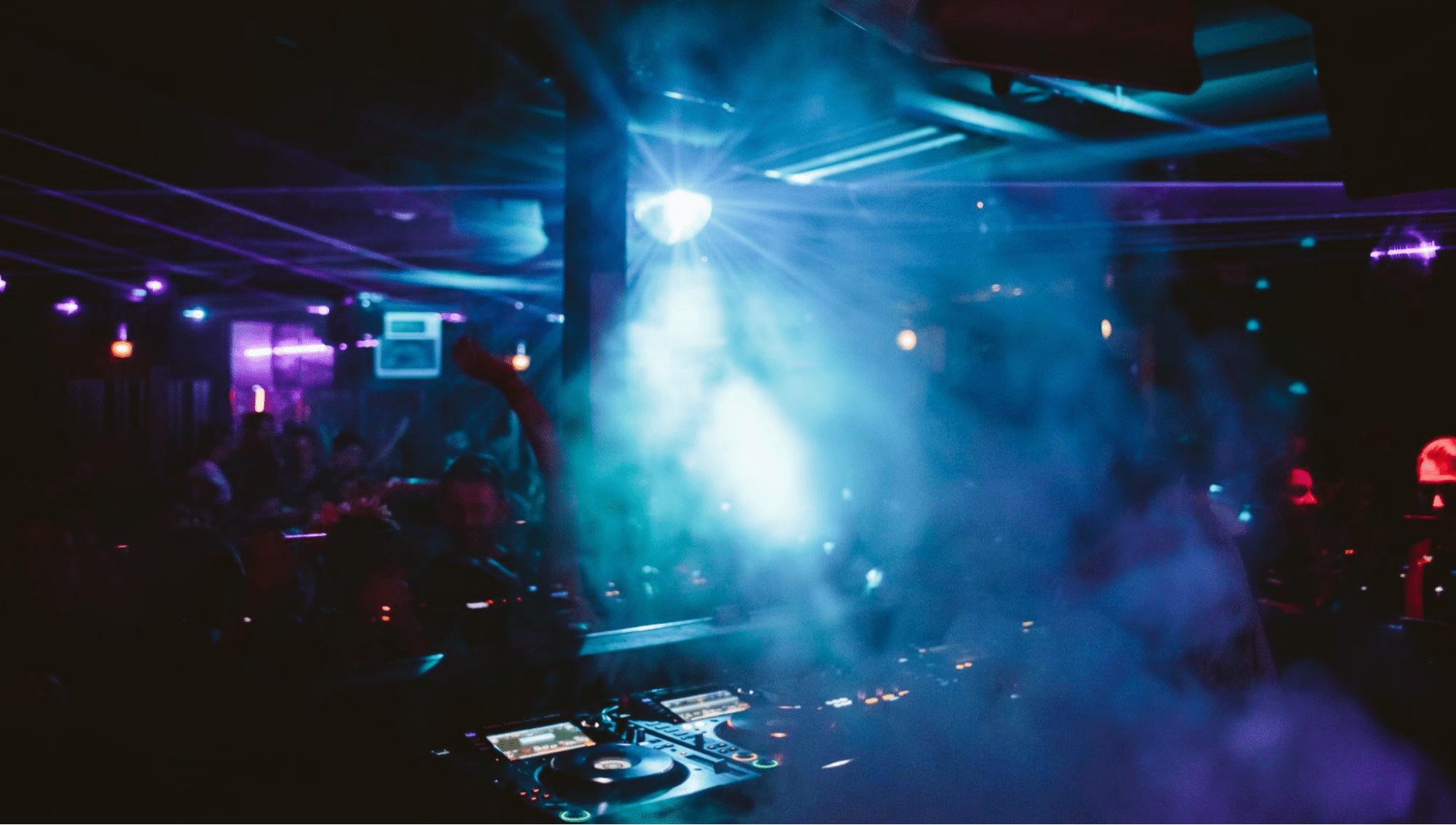 A smoky nightclub dance floor