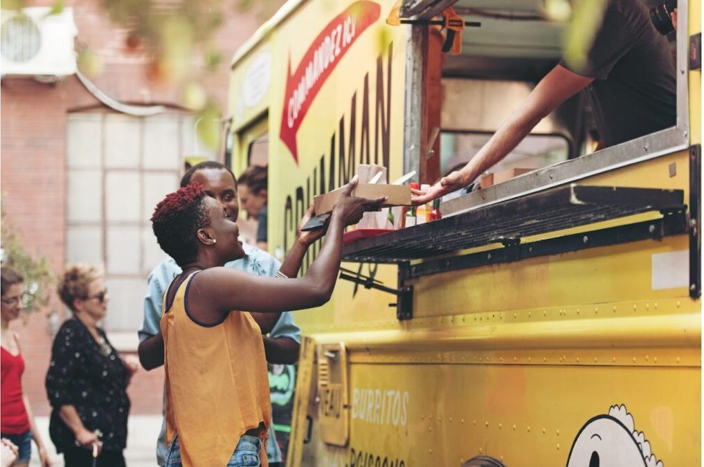 People ordering from food trucks