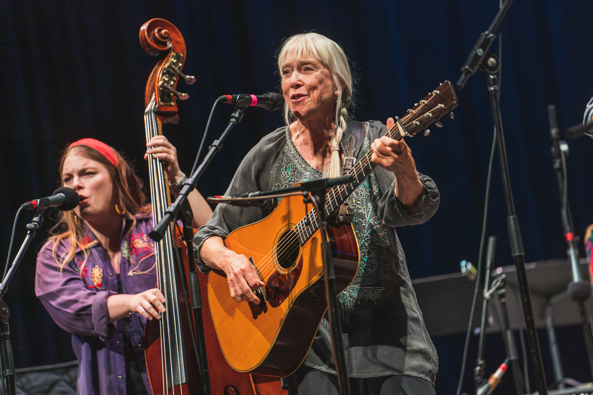 two women performing on stage