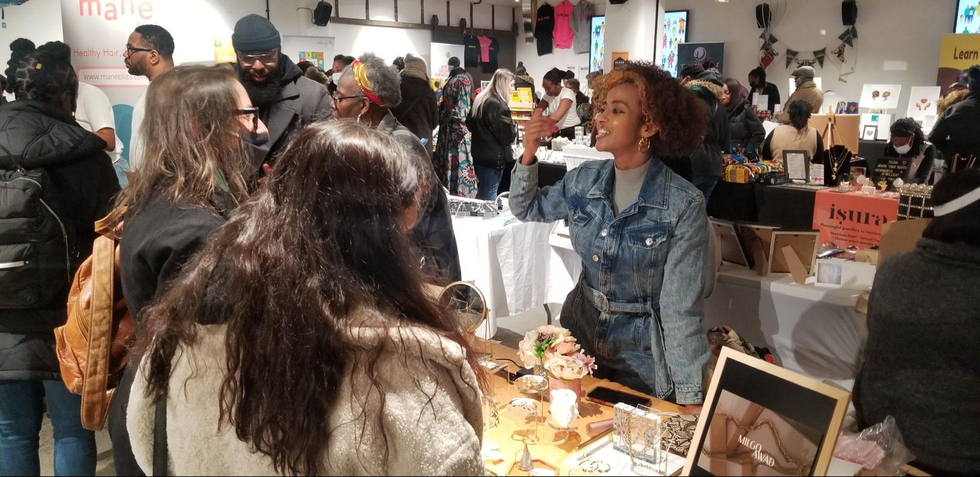 People buying and selling at a pop-up market
