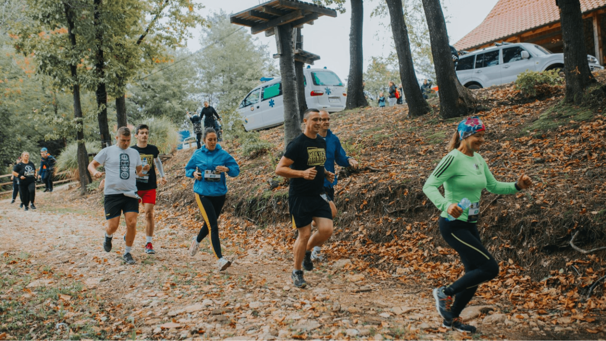 People running on a mountain trail