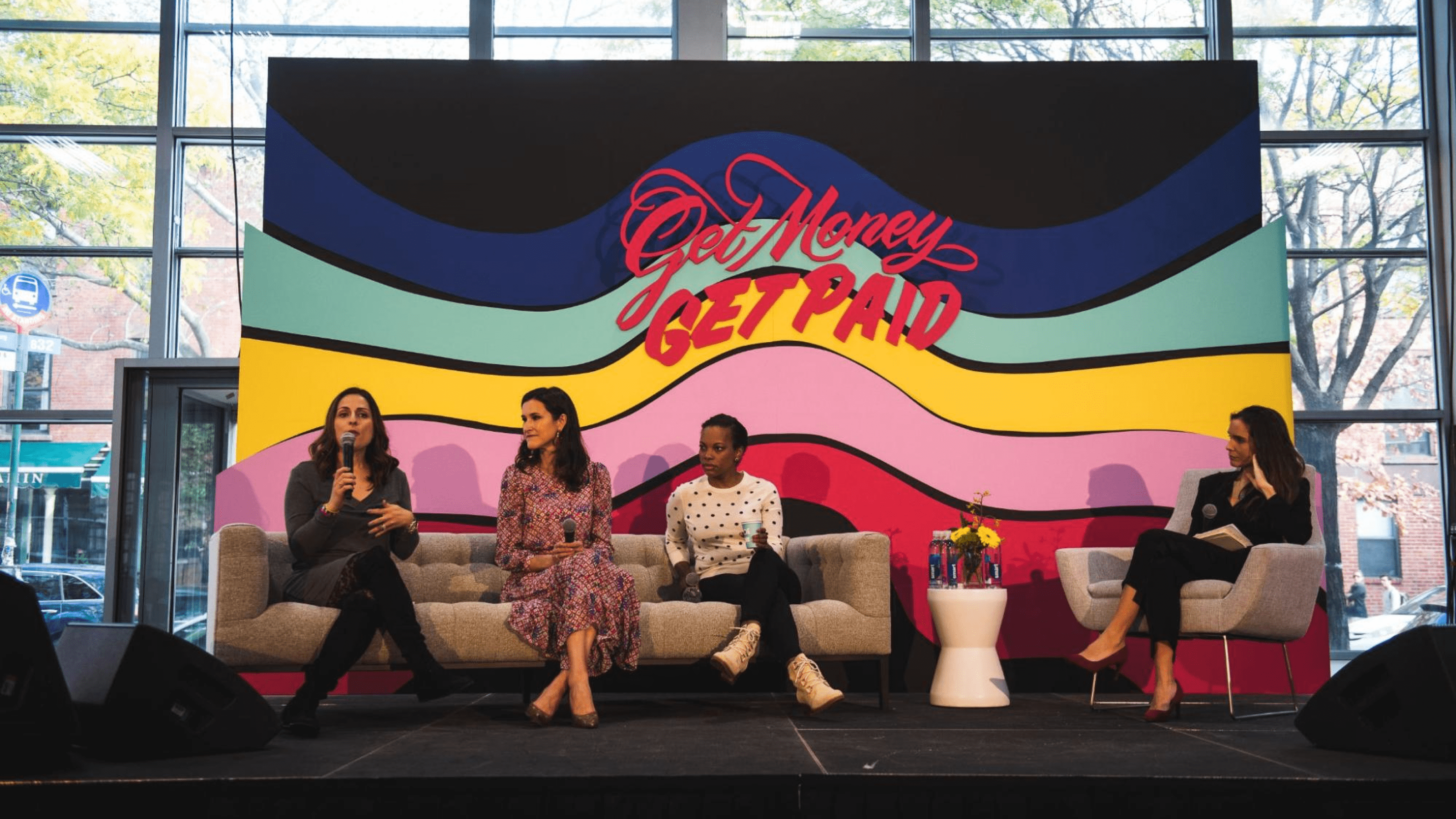 Four people participating in a roundtable discussion