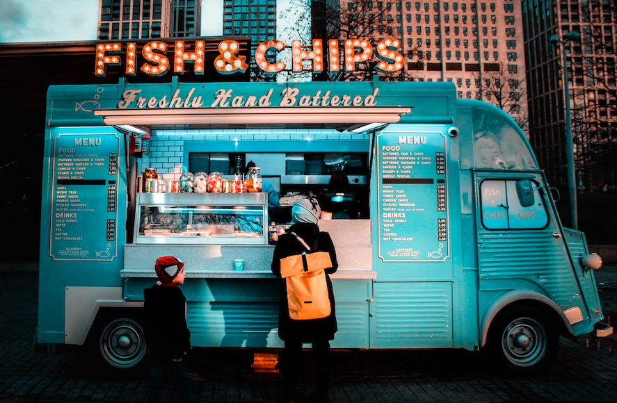 Customers ordering at fish and chips truck