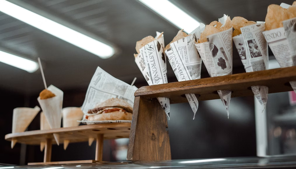 Burgers and crisps sitting on food truck counter