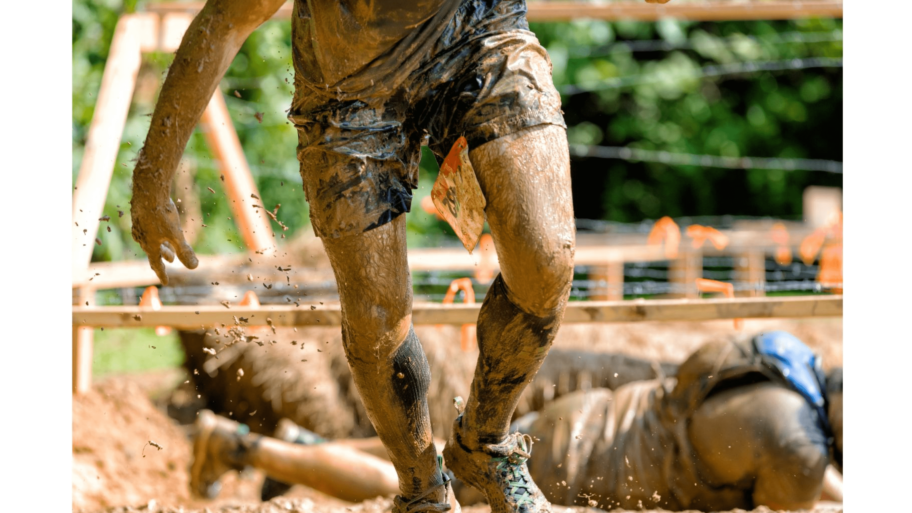 Person doing muddy obstacle course