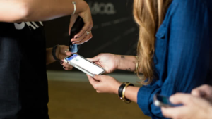 A person scanning their event ticket