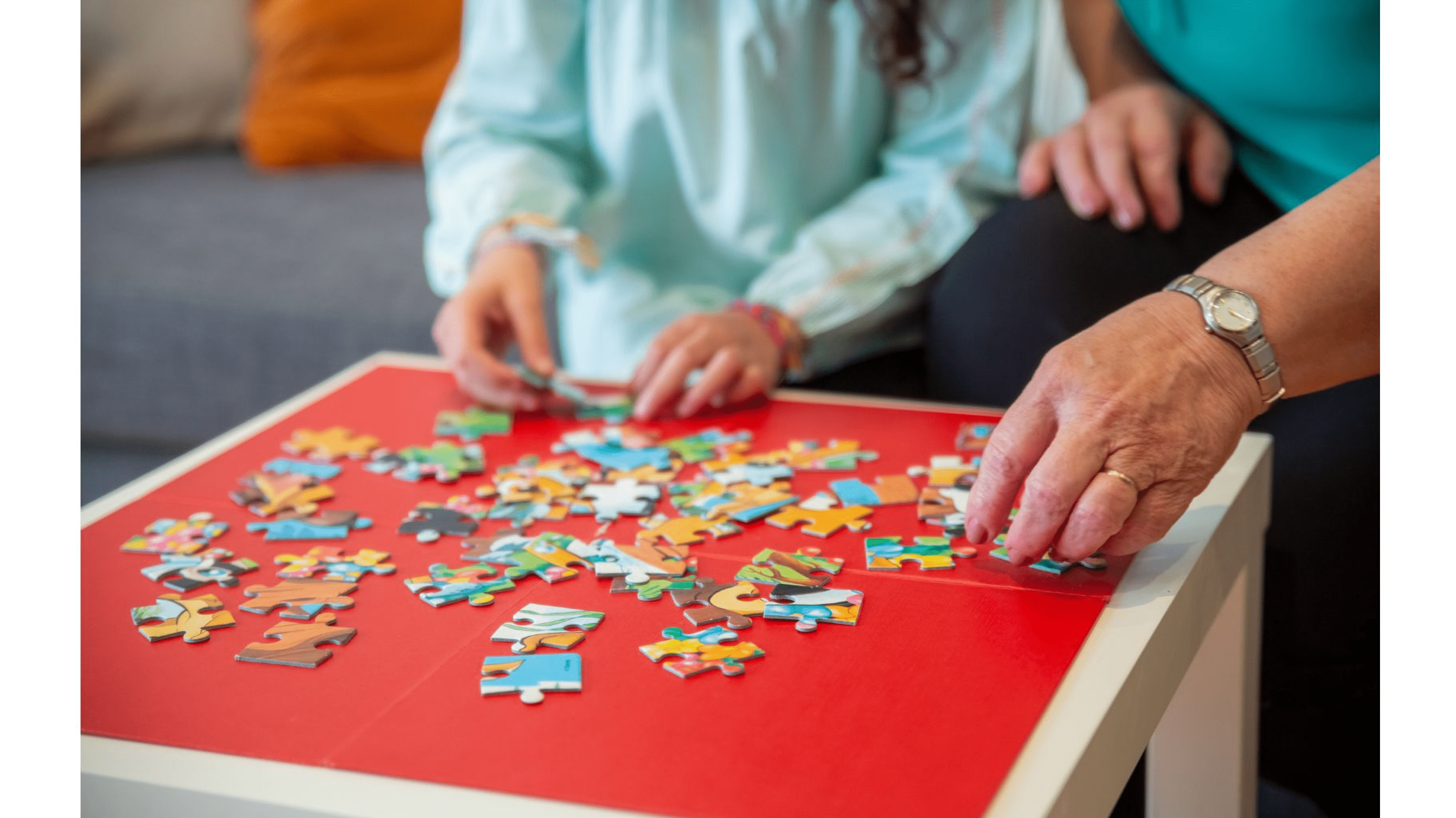 People completing jigsaw puzzles