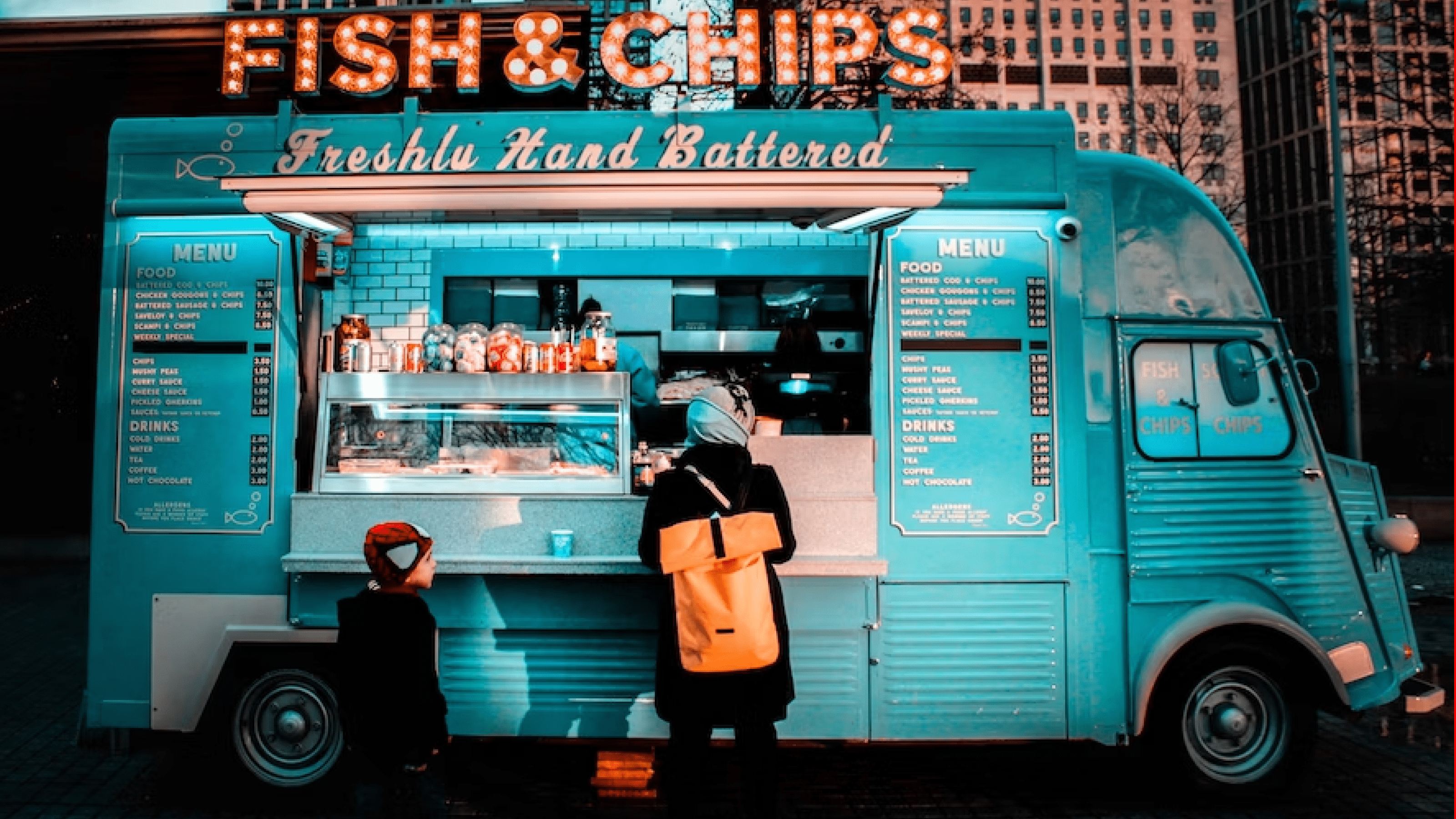 Customers ordering at fish and chips truck