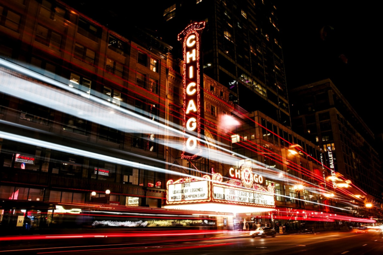 Traffic going past Chicago theatre https://unsplash.com/photos/XXA8PTuLD1Y