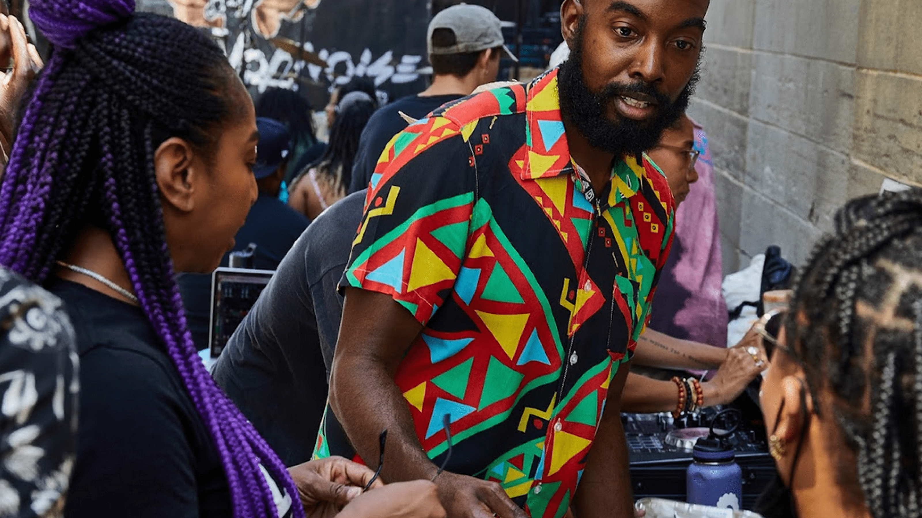 Vendor serving food at a Juneteenth marketplace