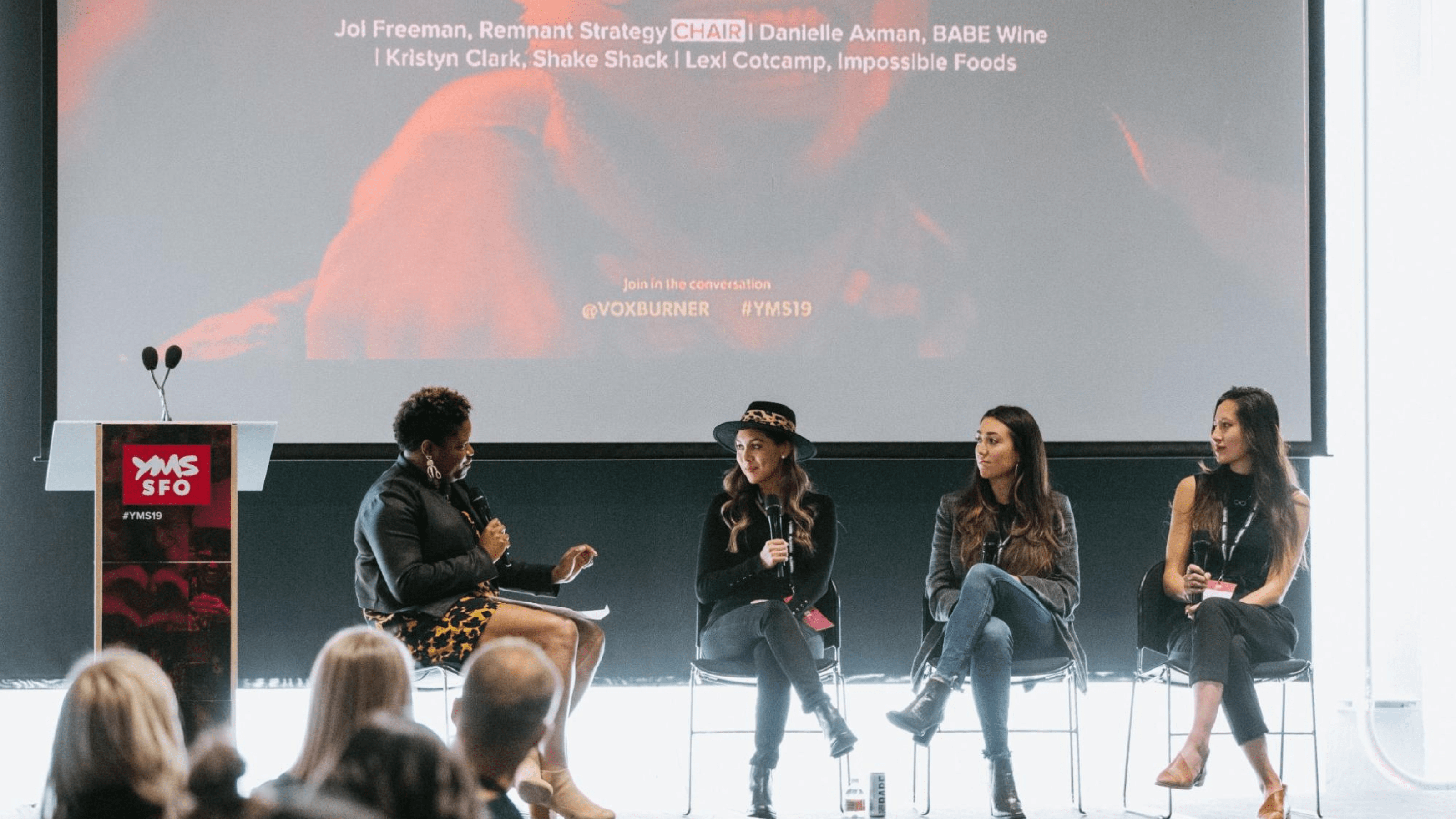 A person asking a question to a panel