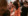 Two women talking with notes Source: