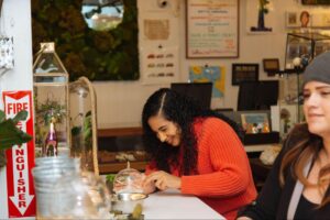 A person working on a terrarium