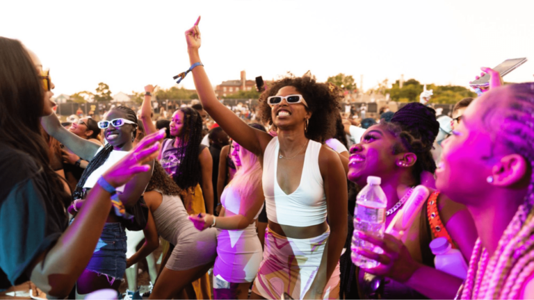 Festival attendees cheer while watching stag