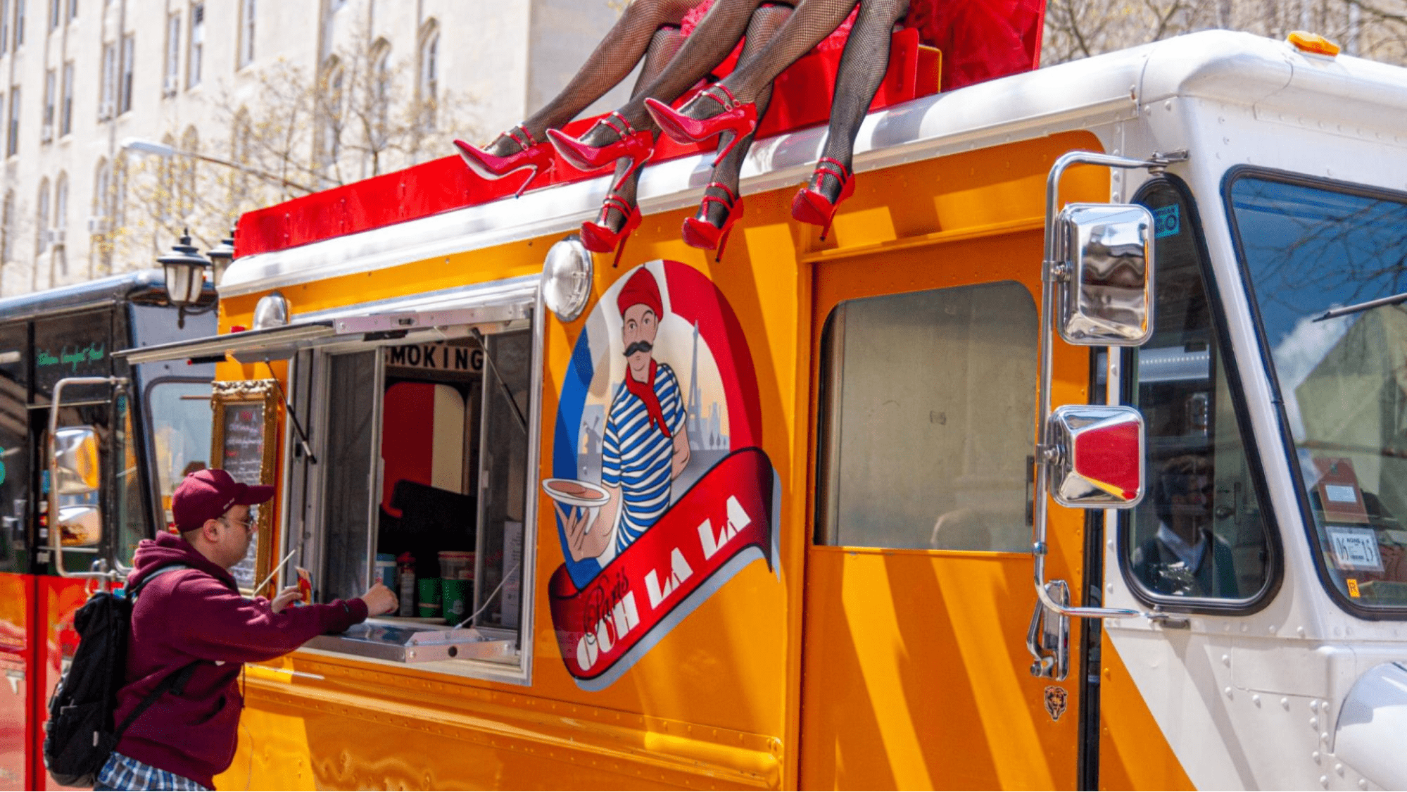 A man ordering from a food truck 