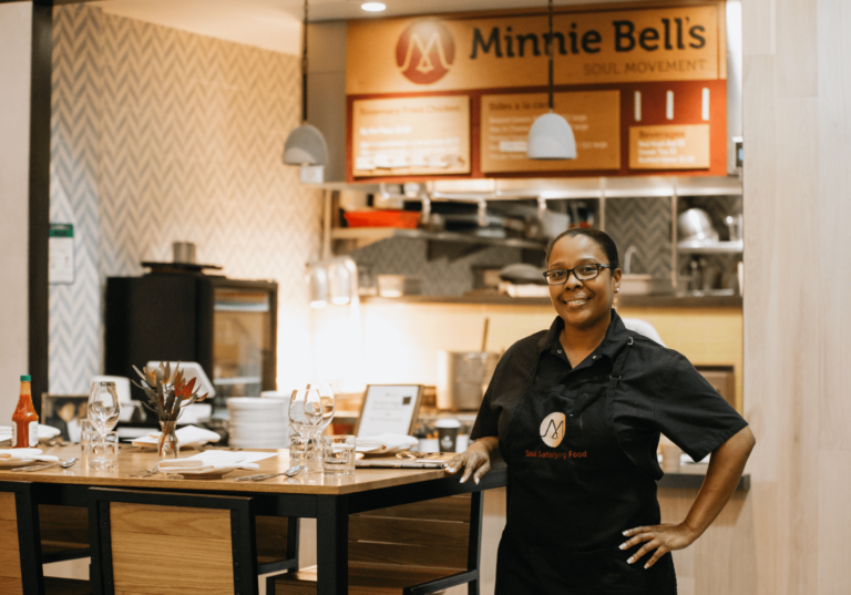 Restaurant owner standing at a table