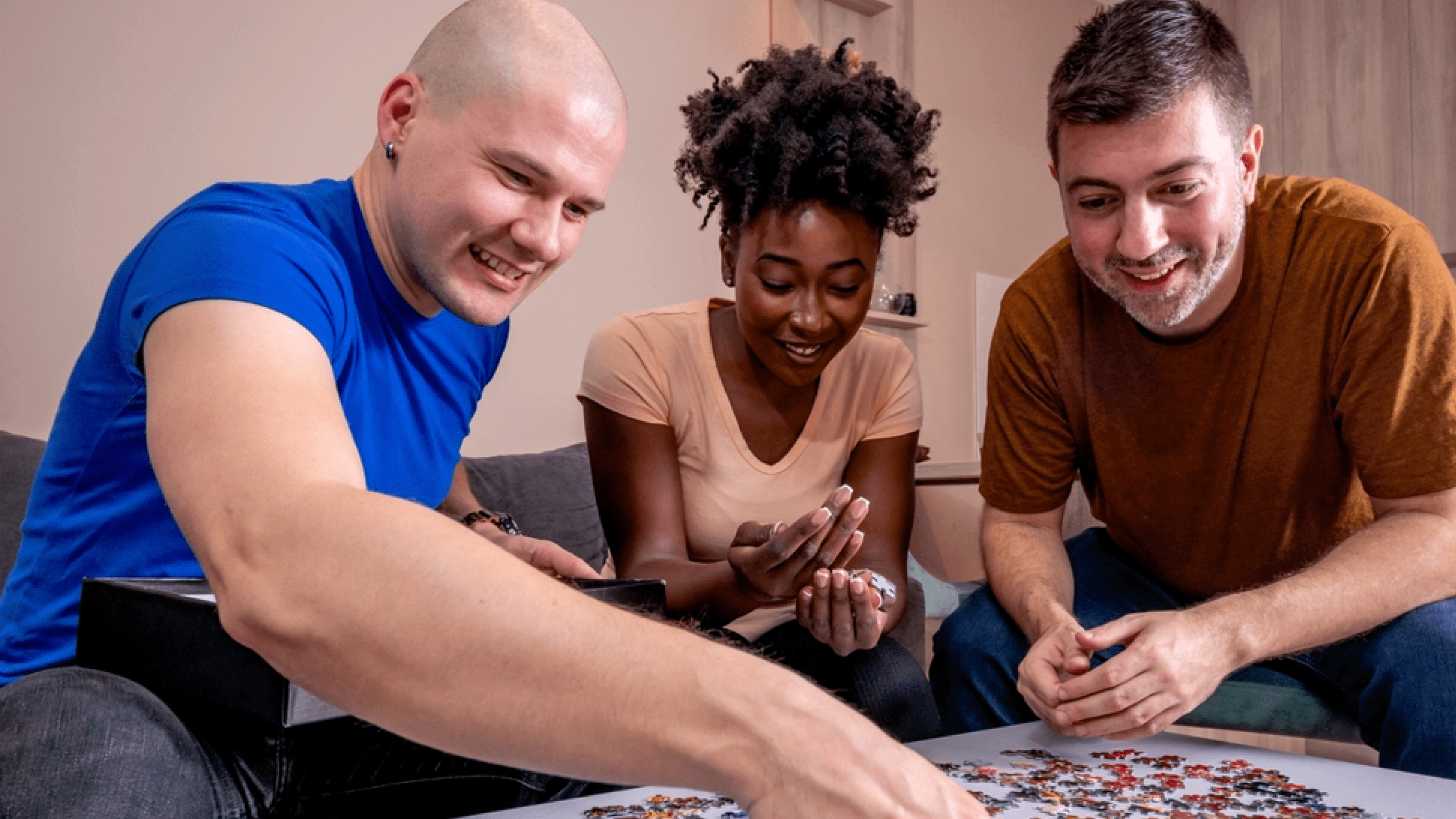 Teammates putting together a jigsaw puzzle