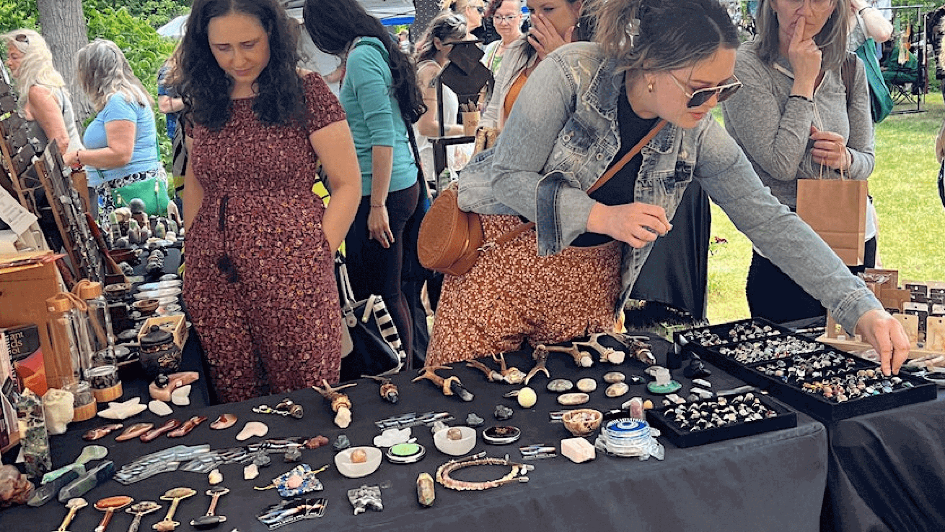 People looking at crafts at a fall festival market