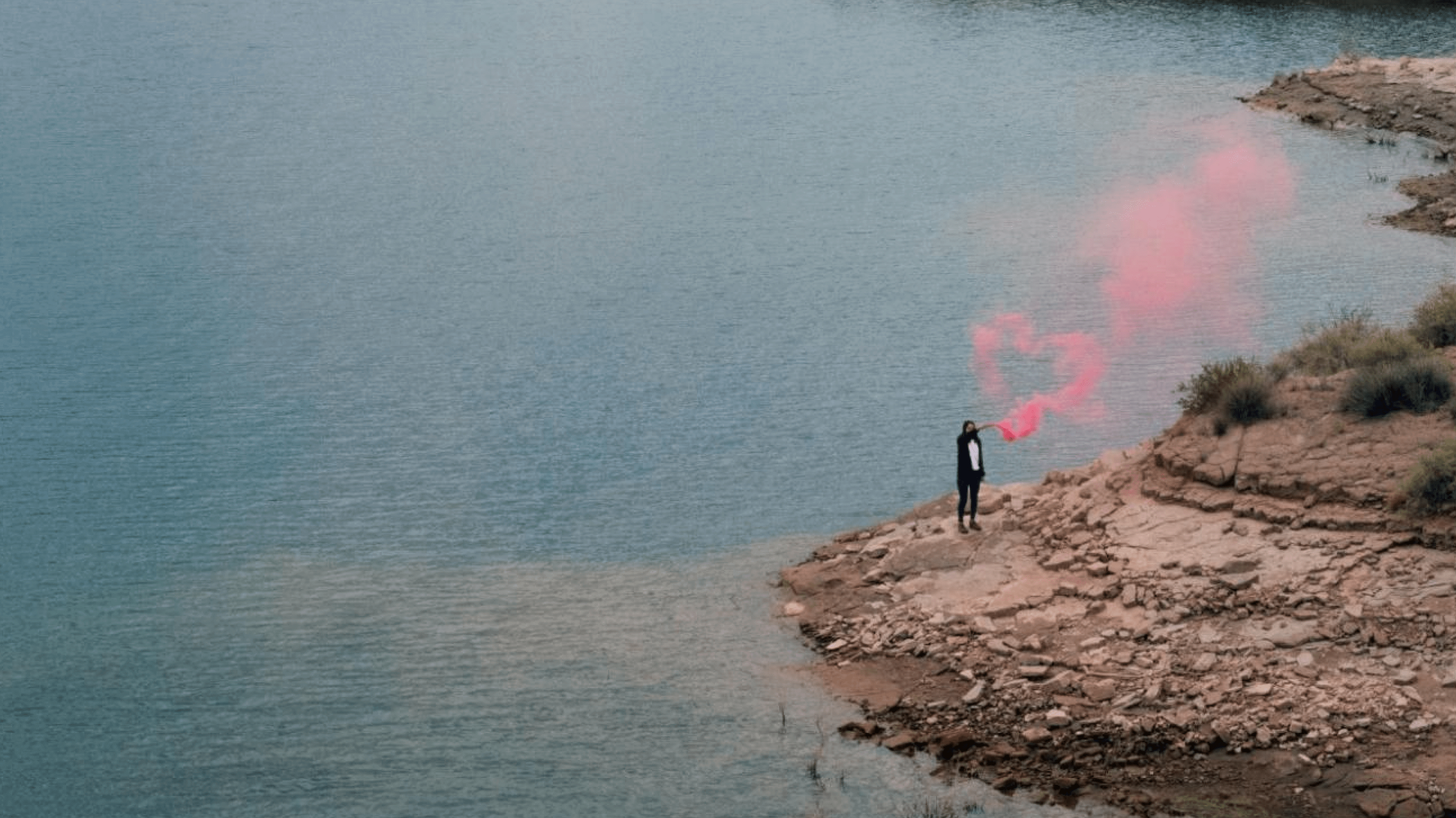 Someone stood on an island waving a smoke cannon