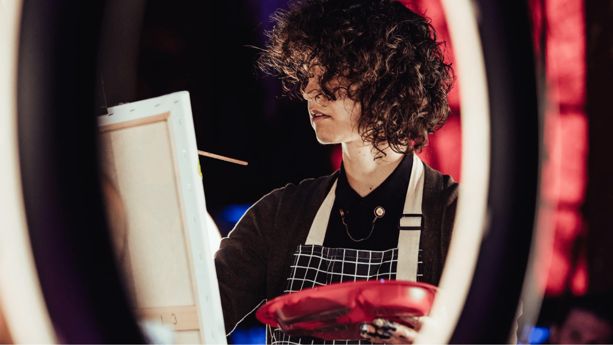 Woman painting on stage