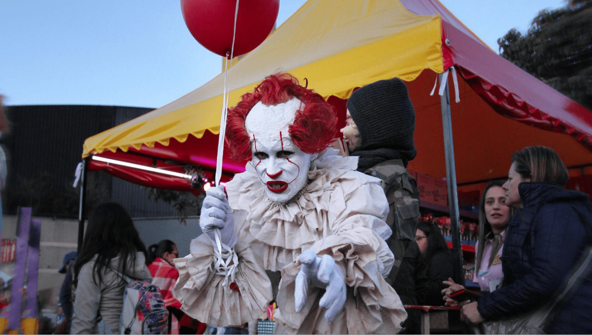 A scary clown at a festival
