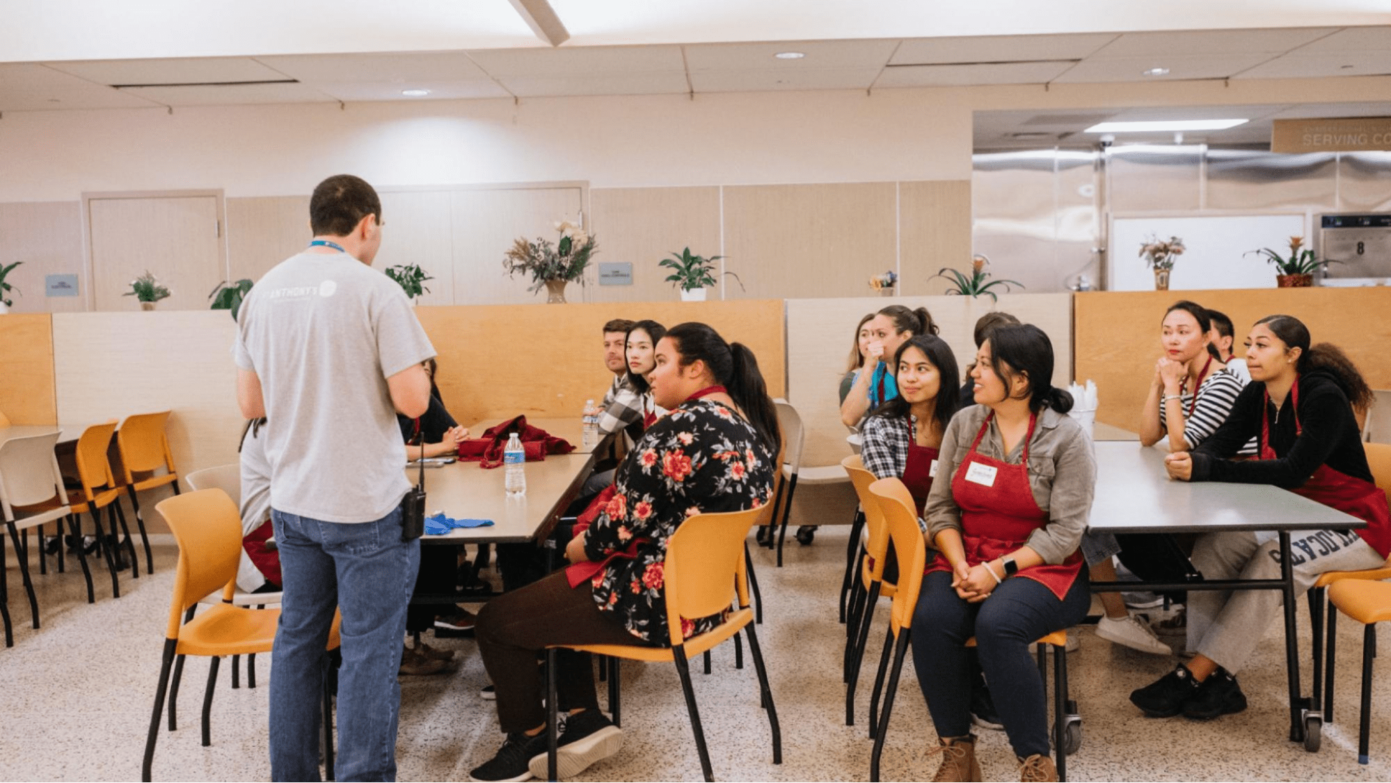 An event organizer speaking to event participants