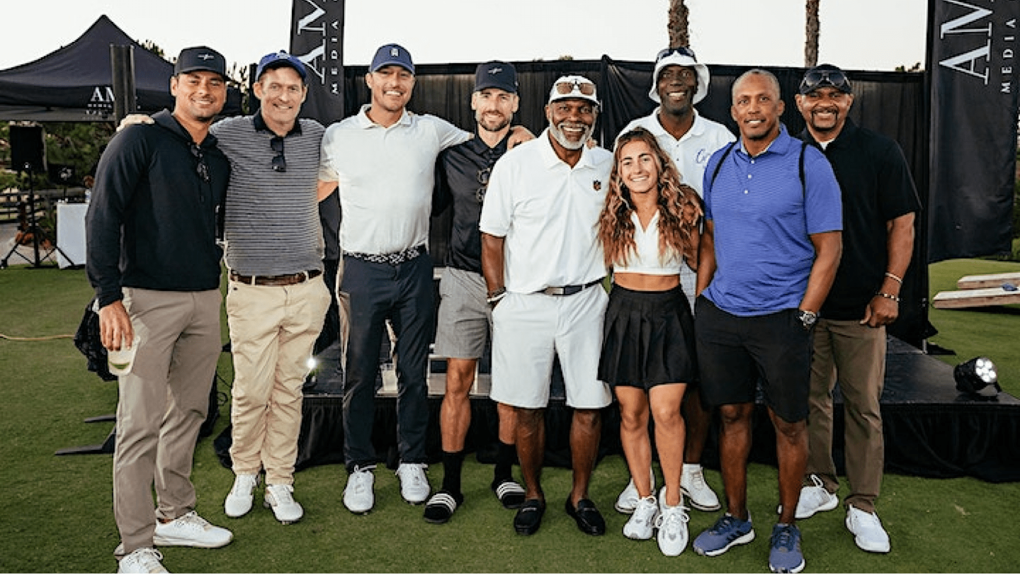 Golf tournament players pose for a photo