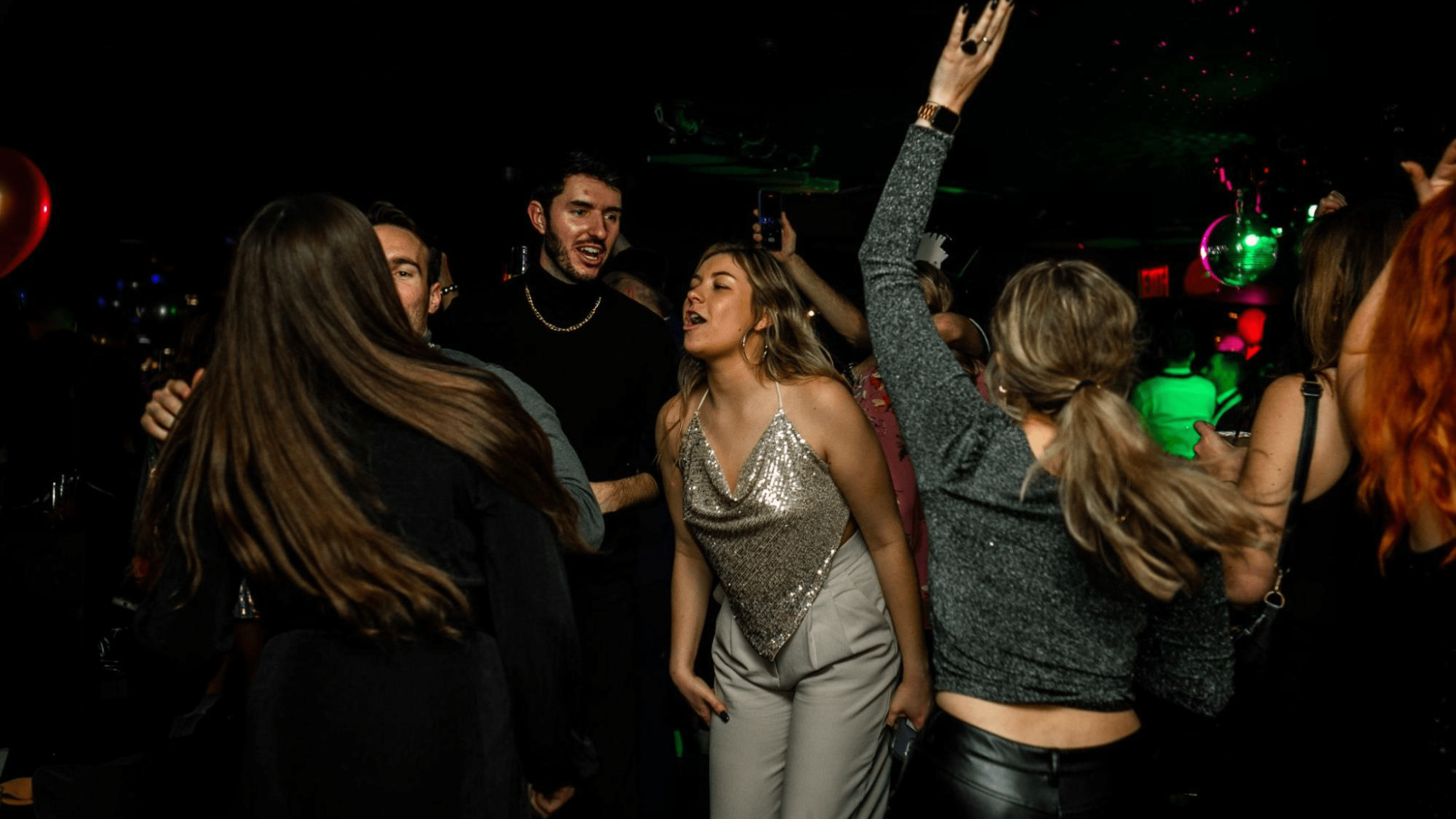 People dancing underground nightclub 