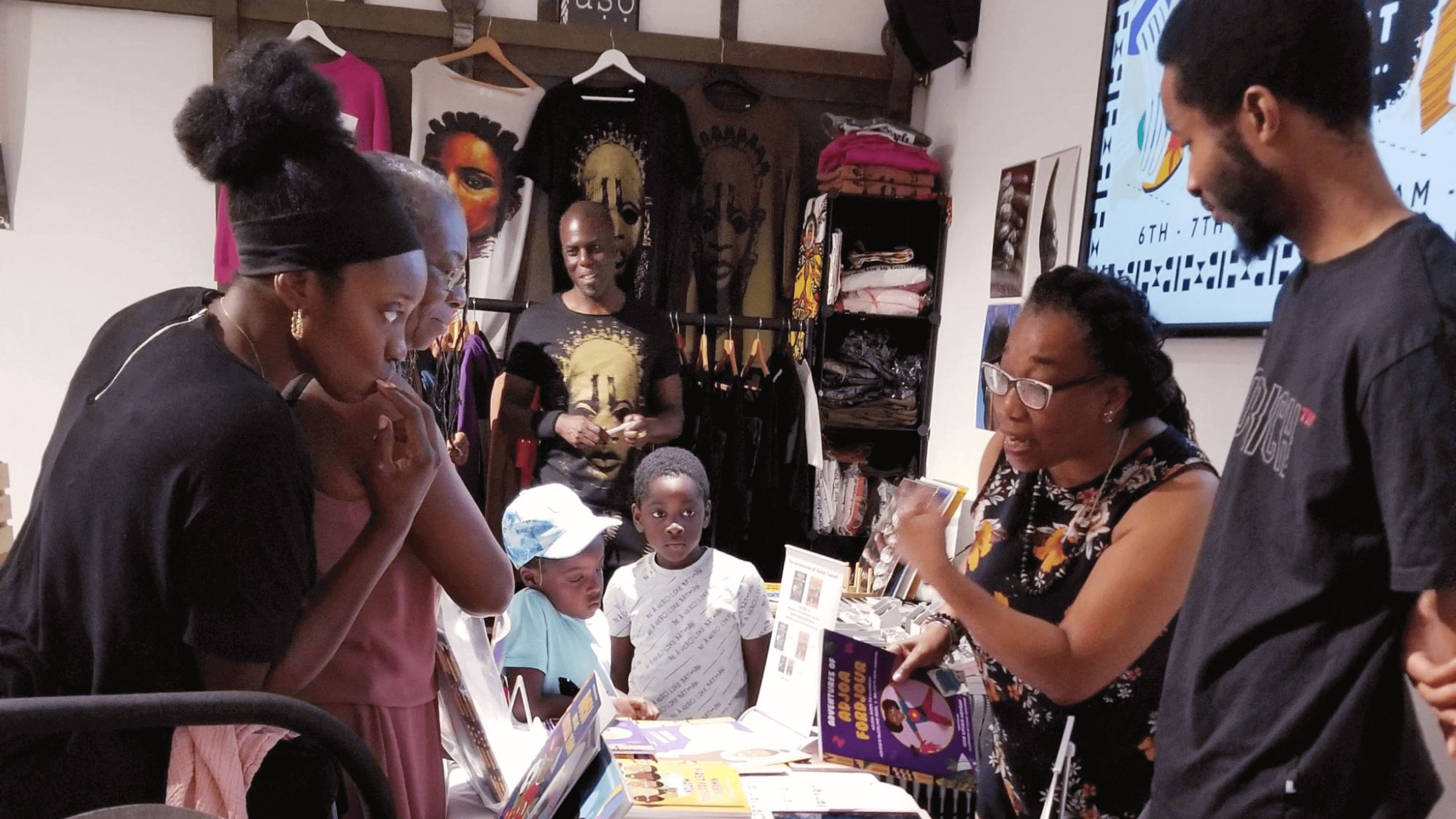 Customers talk to vendor at a craft fair