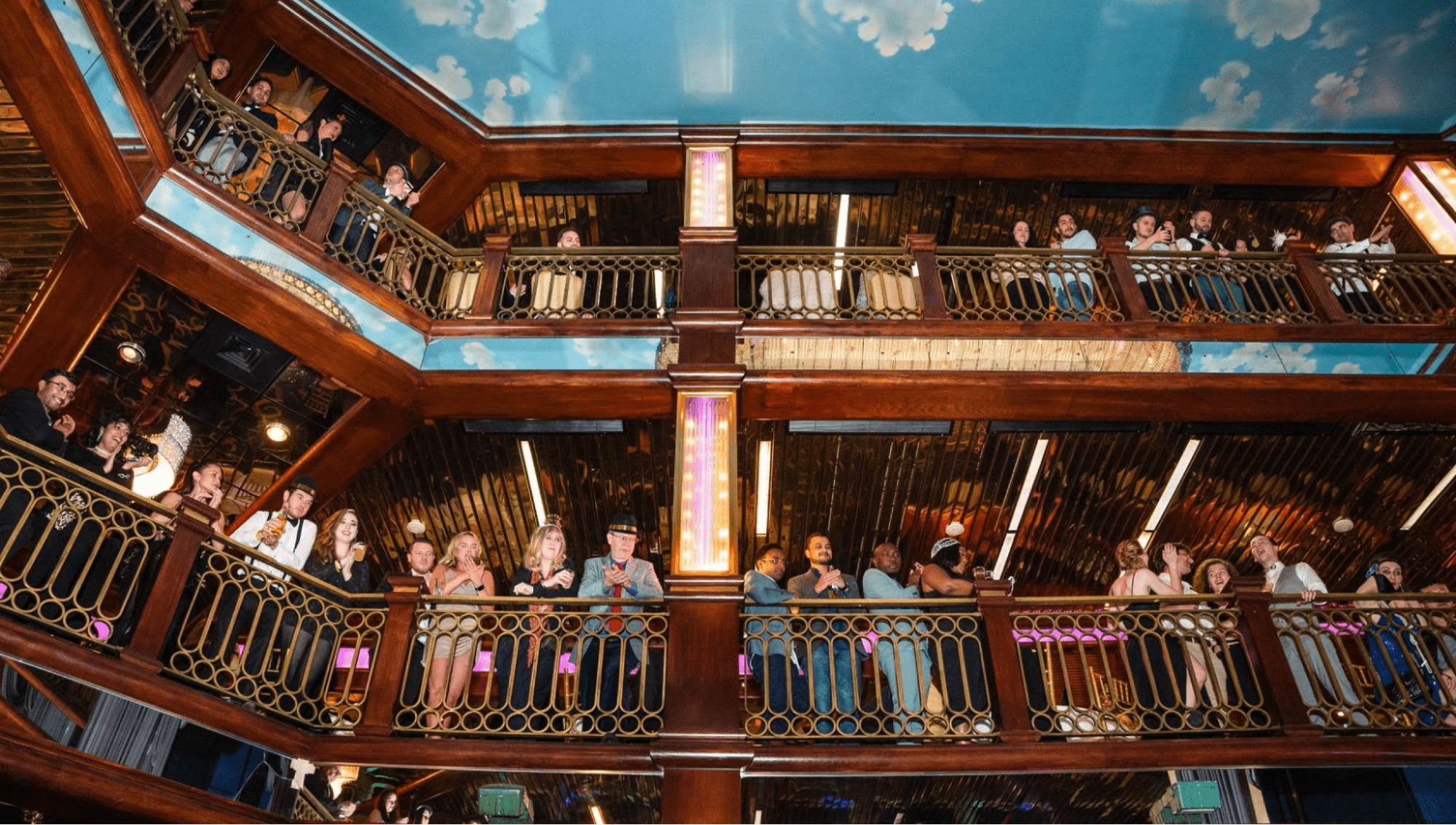 People crowding the balconies at a venue