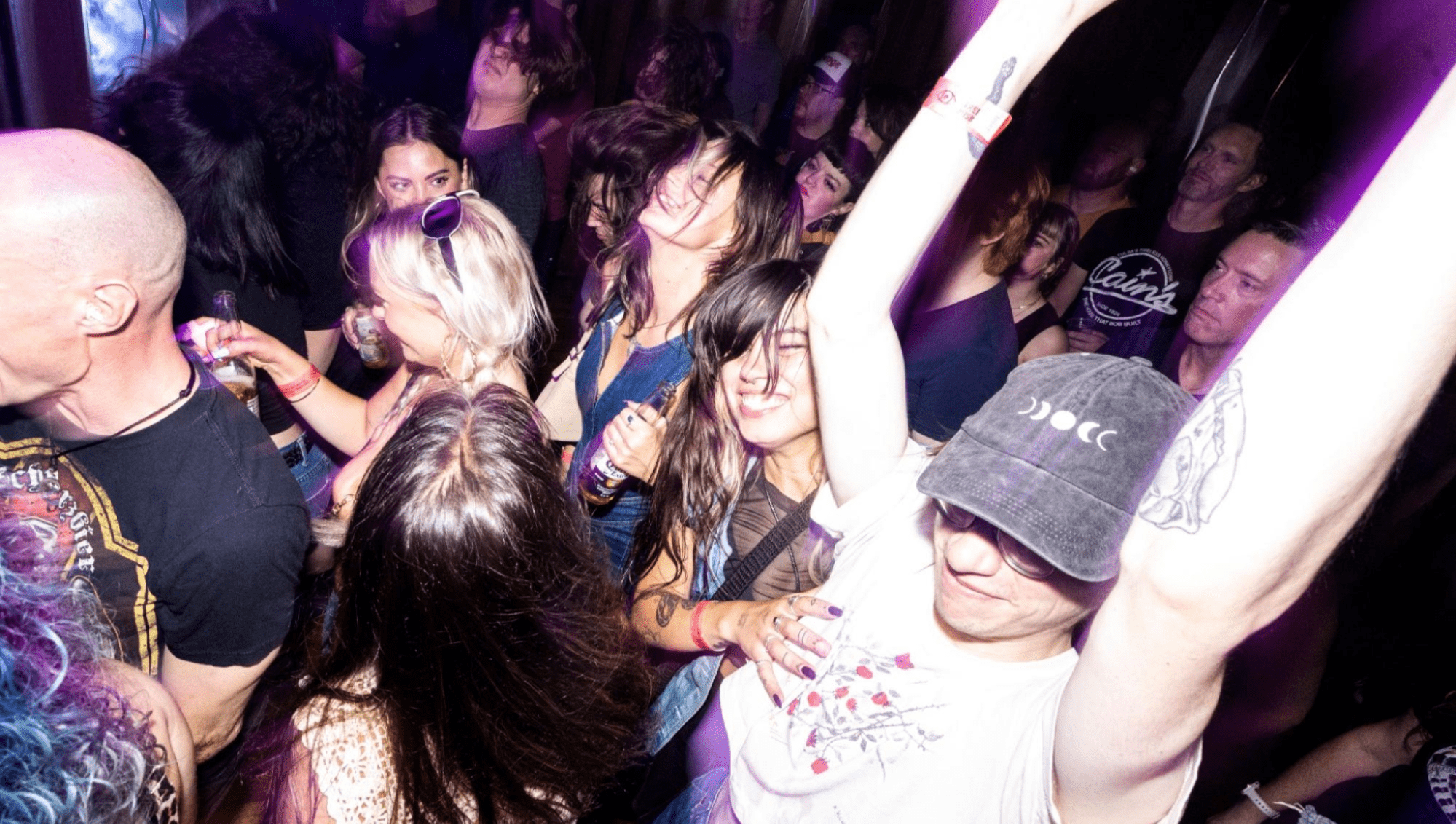 Party-goers dancing in a crowd