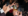 people clinking cheers with drinks