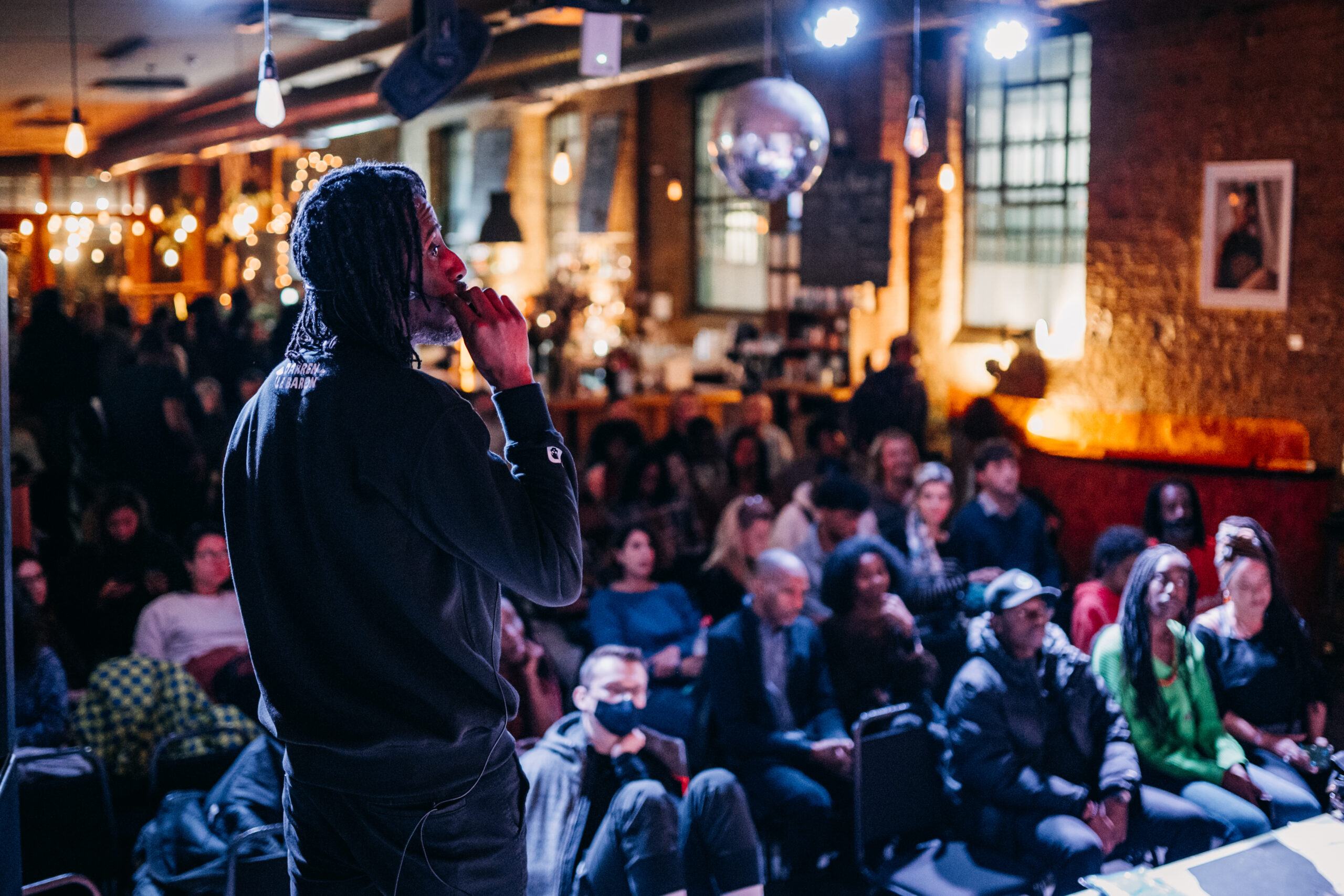 A speaker takes the stage at a Seed Talks event.