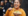 Event guest smiles while eating food at event