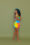 Britteny Floyd-Mayo, aka Trap Yoga Bae, stands laughing and wearing a brightly-coloured outfit.