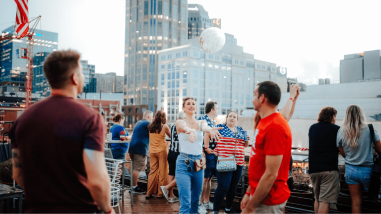 Attendees having fun at a rooftop event
