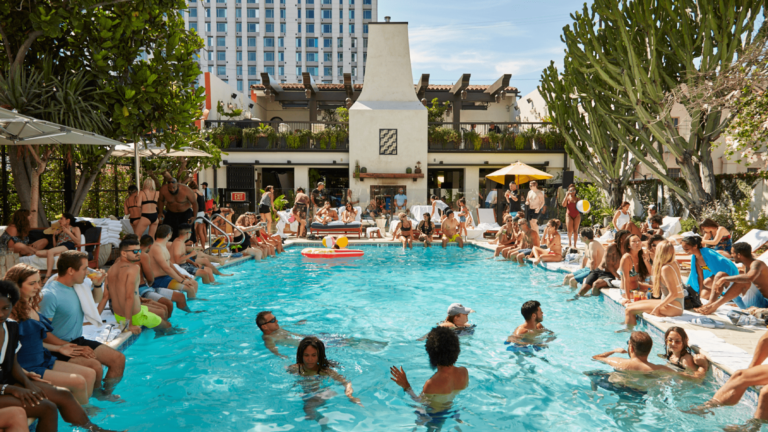Guests swimming at a pool party