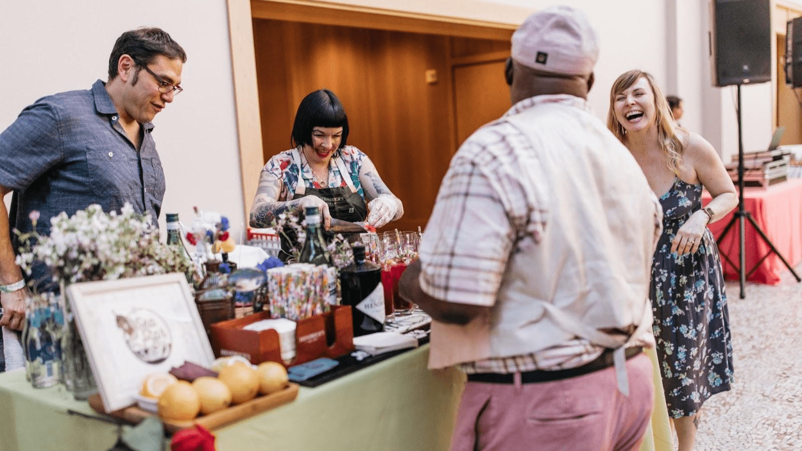 Stallholder laughs with market customer