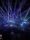 This image shows the view from the dance floor as green, blue and purple strobe lights flash overhead.