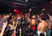 Partygoers dance at a Poof Doof event