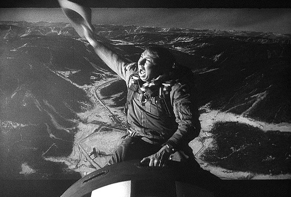 Screen capture of Major Kong riding on top of a bomb falling from a plane in the film, Doctor Stangelove.